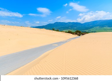 Road and sand dunes near Paloma beach, Costa de la Luz, Spain