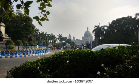 Road Side View And Floral Area Covering The Victoria Memorial