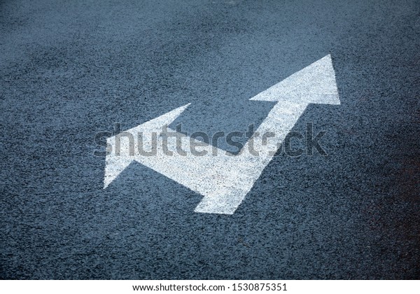 Road sign\
Arrow Straight and Right, on asphalt\
road