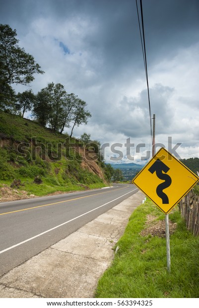 Road sign\
asphalt road rural area of\
Guatemala