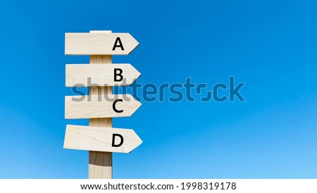 Road sign and blue sky_4 Same direction_Right space_ABCD characters