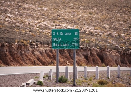 Road sign with distances to S.S Jujuy at 98 Salta 215 Bueno Aires 1750