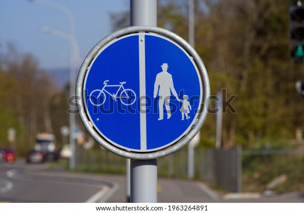 Road sign\
for divided bicycle and pedestrian\
lane.