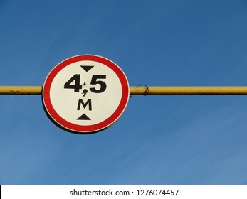 Road Sign Of Height Limitation On The Gas Pipe On Blue Sky Background. 4,5 Meter Car Height Limiter