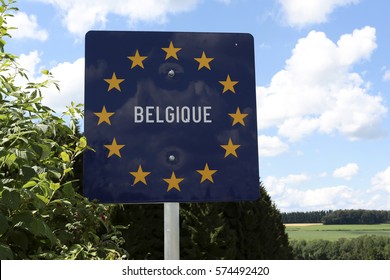 A Road Sign Indicating The Border Of Belgium Seen From Luxembourg 