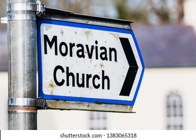 Road Sign To A Moravian Church.