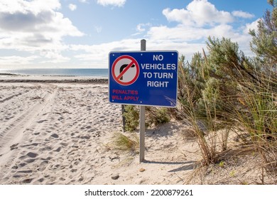 Road Sign On The Sea Beach No Vehicles To Turn Right Penalties Will Apply Australia