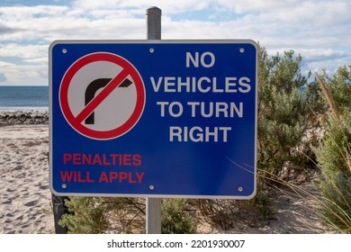 Road Sign On The Sea Beach No Vehicles To Turn Right Penalties Will Apply Australia