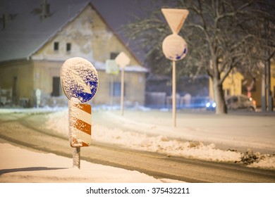 Road Sign On The Street After Snowstorm, Winter And Night Photography, Snow Calamity