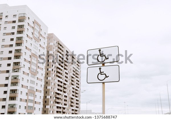 road sign parking only for\
disabled