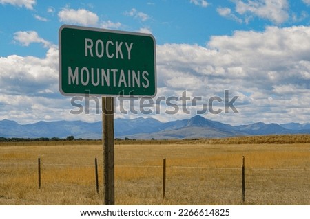 Road sign pointing to Rocky Mountains, Montana, USA