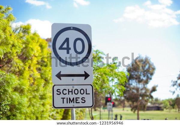 Road\
sign school zone. Australia, Melbourne. City\
street.