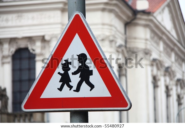 Road\
sign for the security of children near a\
school.