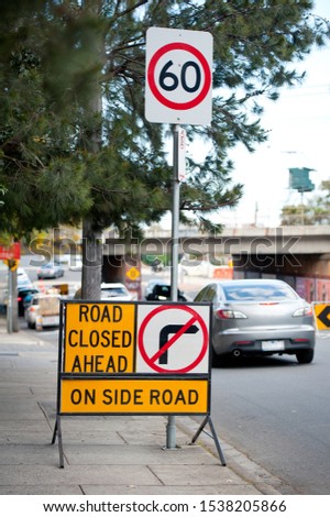 Road sign staying on the city street. Australia, Melbourne. 