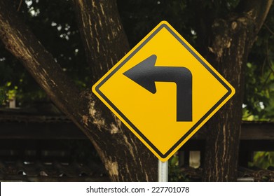 Road Sign Indicating Sharp Left Turn Stock Photo (Edit Now) 1761317549