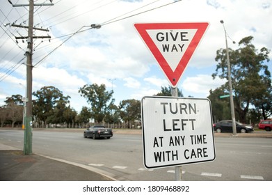 Road Sign Turn Left At Any Time With Care. Australia, Melbourne. Warning Sign.  Give Way.