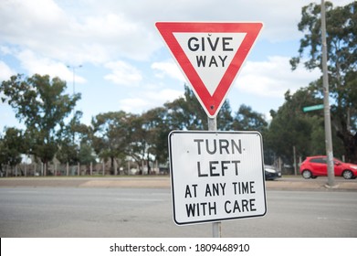 Road Sign Turn Left At Any Time With Care. Australia, Melbourne. Warning Sign.  Give Way.