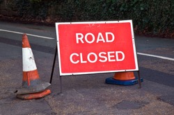 Road Sign In The UK Indicating That The Road Ahead Is Closed.