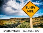 Road sign warning about a Bumpy Ride ahead on deserted scenic summer desert highway 