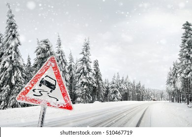 Road Sign Warning Against Slippery Road Due To Snow Ice