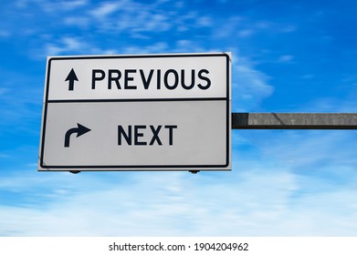 Road sign with words previous and next. White two street signs with arrow on metal pole. Directional road, Crossroads Road Sign, Two Arrow. Blue sky background - Shutterstock ID 1904204962