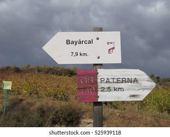 Road Signs Against Vineyard And Dark Sky In Sierra Nevada Region Of Andalusia, Spain