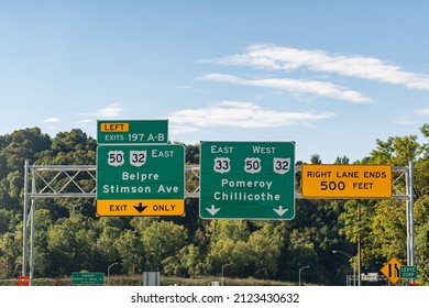 Road signs in Athens, Ohio on Route US 33 for Exit 197 A-B for Belpre, Stimson Ave and continuing on Routes US 33, US 50 and Ohio 32