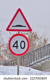 Road Signs By The Side Of The Road On A Snowy Winter Day