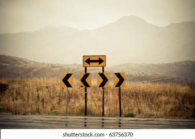 Road Signs At The End Of The Road Pointing Left And Right