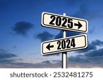 Road signs indicate the path to the new year 2025 and the old year 2024 on a blue sky, creative idea. Choose a new road, concept. Change for the better