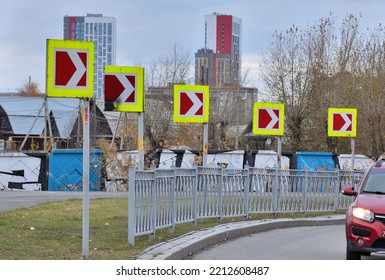 Road Signs On A Sharp Turn Of The Road On An Autumn Day