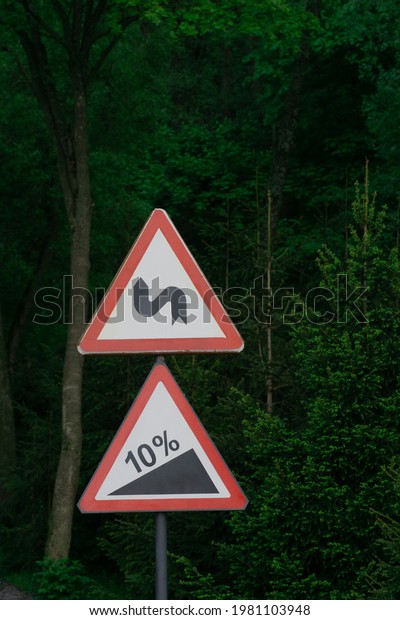 road signs, sign a\
curving road to the top