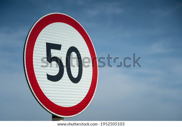 Road signs speed limit 50 km per hour. Close up\
shot raw footage.
