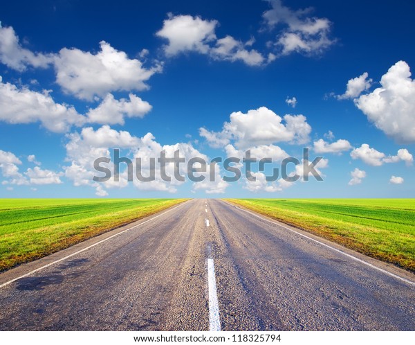 Road and\
sky with white clouds. Abstract\
landscape