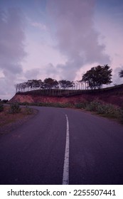 a road slightly uphill and deserted of vehicles taken at dusk - Shutterstock ID 2255507441