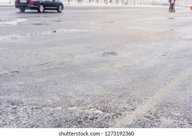 The Road Is Sprinkled With Soda Salt Solution Anti-slip, Safety On The Road In Winter