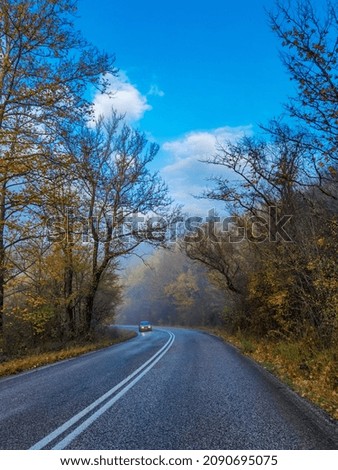 road street in winter and autumn in vrosina village greece rain fog drivirng