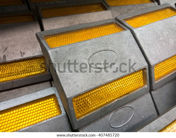 Road stud with yellow\
reflector 