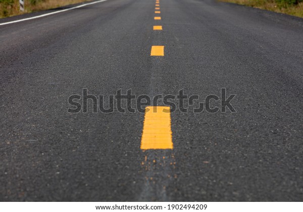 The road surface that is marking a
new lane.
(background,texture)