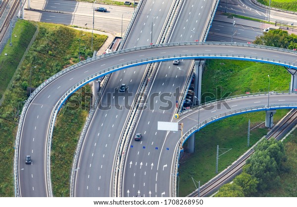 Road system. Road interchanges.\
Multi-level highways. The movement of vehicles on highways in\
different directions. View of multi-level roads from a\
height.