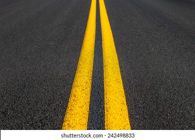 Road texture with two yellow stripes
