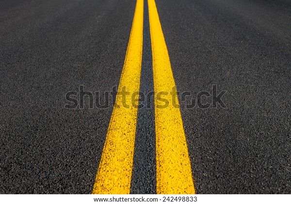 Road texture with two\
yellow stripes