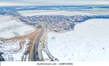 Road that connects villages on the coastline of the frozen bay. Odessa, Sukhyi Lyman, Ukraine, January 2019.