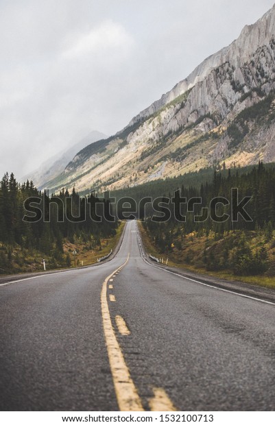 Road\
through the Canadian Rocky Mountains in Autumn\
