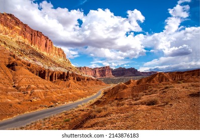 The road through the canyon on a clear day. Canyon road in desert. Beautiful canyon road landscape. Road in red rock canyon landscape