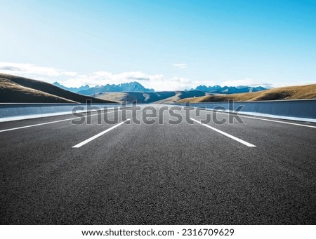 A road with tire tracks on it and the sky is background beauty nature