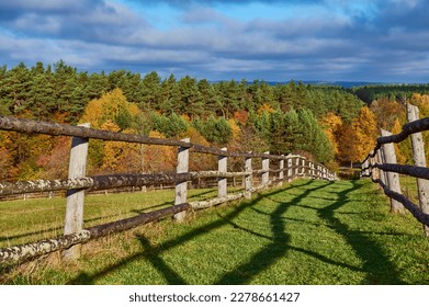 The road to the top of the mountain is fenced with wooden handrails - Shutterstock ID 2278661427