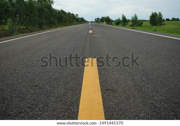 Road traffic paint on the asphalt surface And to\
ensure safety