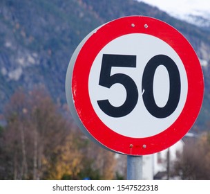 Road traffic sign speed limit 50 on background of mountains - Shutterstock ID 1547522318