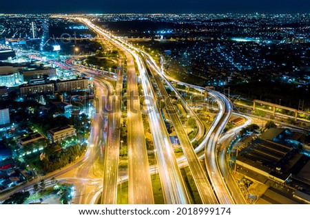 Road traffic transportation timelapse. Road and Roundabout, multilevel junction motorway, multiple roads in city, vehicular intersection, expressway with important infrastructure.